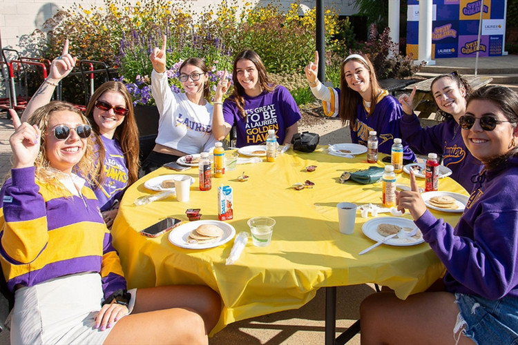 Students enjoying a pancake breakfast